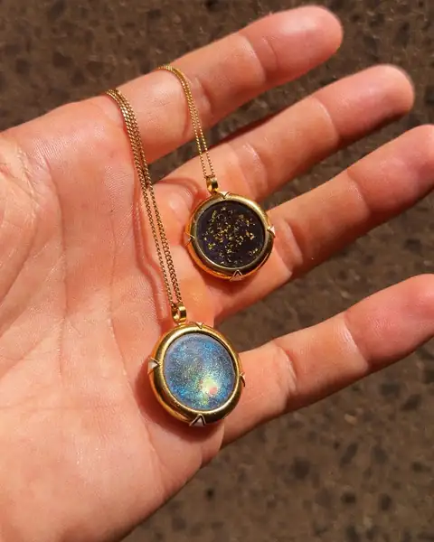 Two Aquari pendants in Sol Brah’s palm