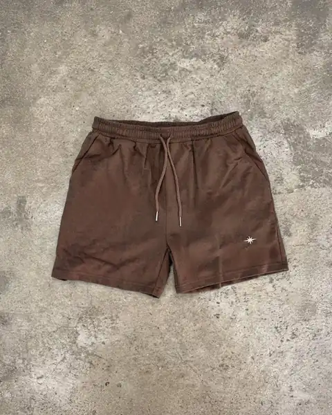 Brown Sol Dept cotton shorts on concrete